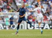 DONETSK, UKRAINE - JUNE 11: Philippe Mexes of France and James Milner of England battle for the ball during the UEFA EURO 2012 group D match between France and England at Donbass Arena on June 11, 2012 in Donetsk, Ukraine. (Photo by Julian Finney/Getty Images)