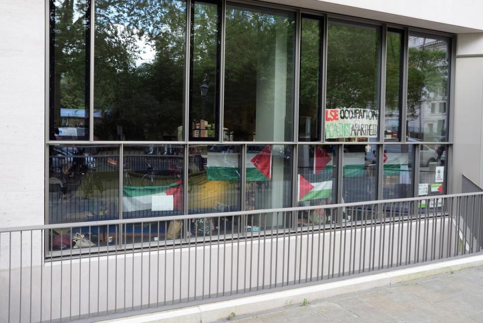 Posters and flags have been placed inthe windows. (Jordan Pettitt/PA Wire)