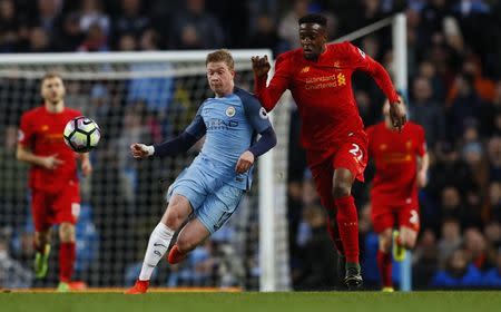 Britain Soccer Football - Manchester City v Liverpool - Premier League - Etihad Stadium - 19/3/17 Liverpool's Divock Origi in action with Manchester City's Kevin De Bruyne Action Images via Reuters / Jason Cairnduff Livepic