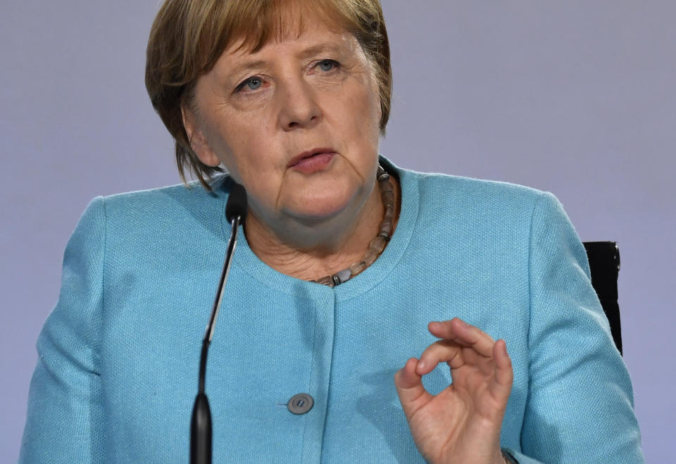 German Chancellor Angela Merkel speaks at a press conference at the Chancellery in Berlin, Wednesday June 3, 2020, after coalition meetings. Germany’s governing parties agreed on a 130 billion euro ($146 billion) stimulus package Wednesday meant to help kick-start Europe’s biggest economy, which has taken a heavy hit from the coronavirus pandemic. Following two days of talks in Berlin, Chancellor Angela Merkel said the package was a “bold response” that would boost consumption and investment and ease the strain on families and others. (John MacDougall/Pool via AP)