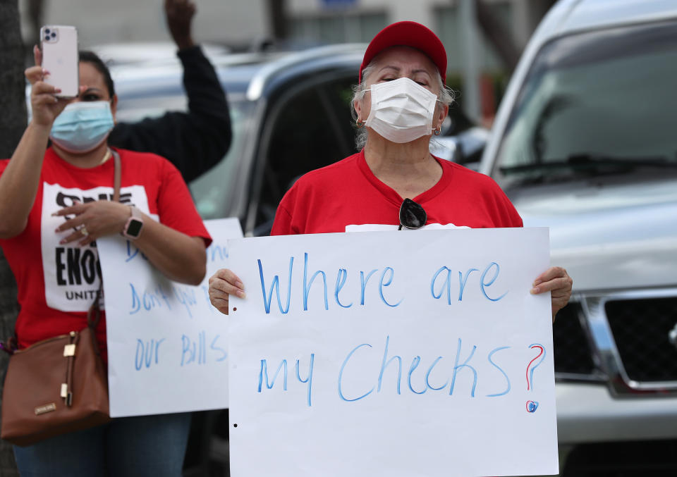 Protesters stand together demanding that the state of Florida fix its unemployment system on May 22 in Miami Beach, Florida. (Photo: Joe Raedle via Getty Images)