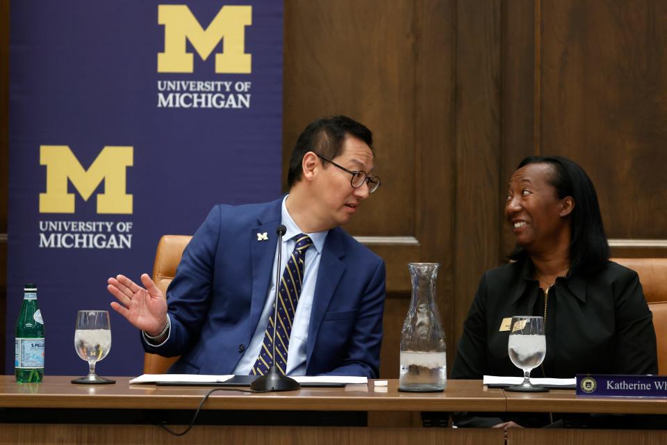 (L to R) Dr. Santa Ono, named the new University of Michigan president by the U of M Board of Regents talks with regent Katherine White before the press conference at the Ruthven Building at the Ann Arbor campus on July 13, 2022.