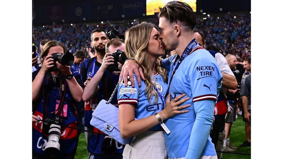 Manchester City's English midfielder #10 Jack Grealish celebrates with his girlfriend Sasha Attwood after winning the UEFA Champions League final football match between Inter Milan and Manchester City at the Ataturk Olympic Stadium in Istanbul, on June 10, 2023