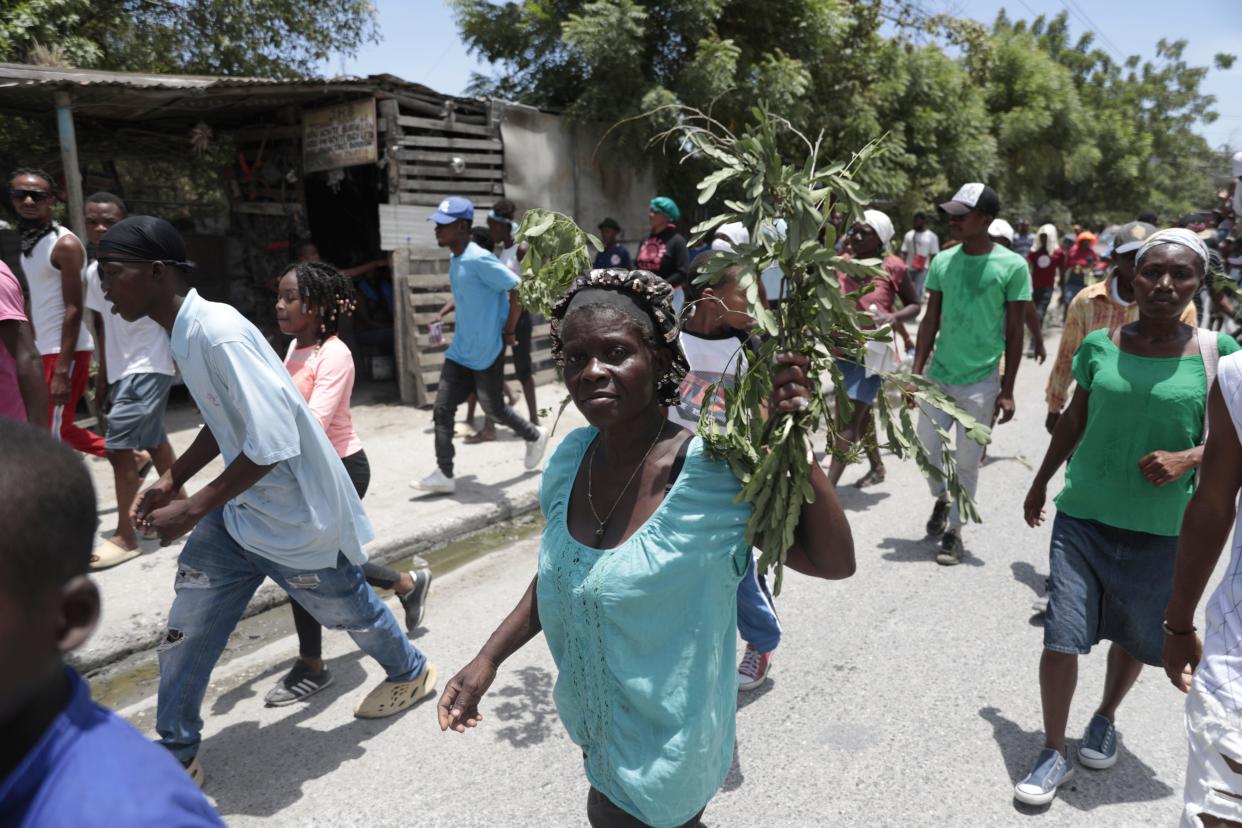 People march to demand the freedom of New Hampshire nurse Alix Dorsainvil and her daughter, reported kidnapped, in tPort-au-Prince, Haiti, on July 31, 2023.