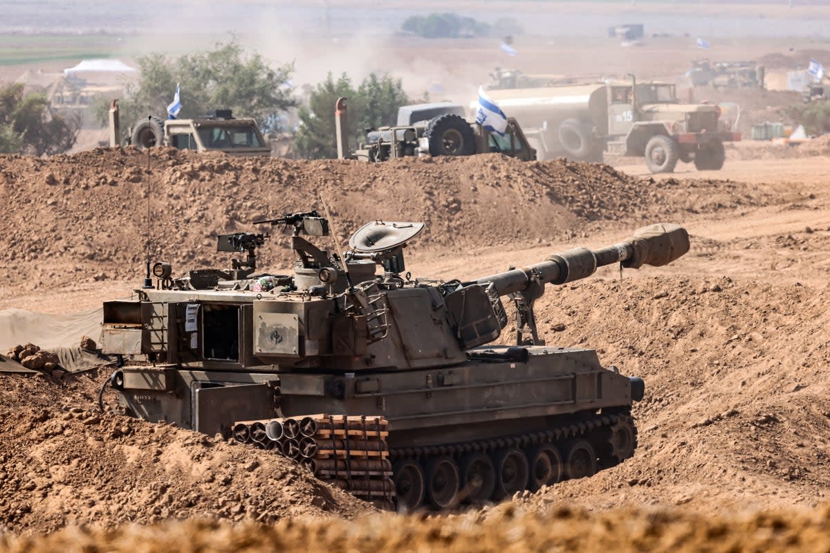 Israeli soldiers prepare for ground maneuvers at an undisclosed location near the border with Gaza (EPA)