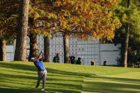 FILE - In this Nov. 14, 2020, file photo, Jon Rahm, of Spain, hits on the 13th hole during the third round of the Masters golf tournament in Augusta, Ga., in this Saturday, Nov. 14, 2020, file photo. Last year the Masters was played in November, amid autumn hues of gold, orange and red in the trees. (AP Photo/Matt Slocum, File)