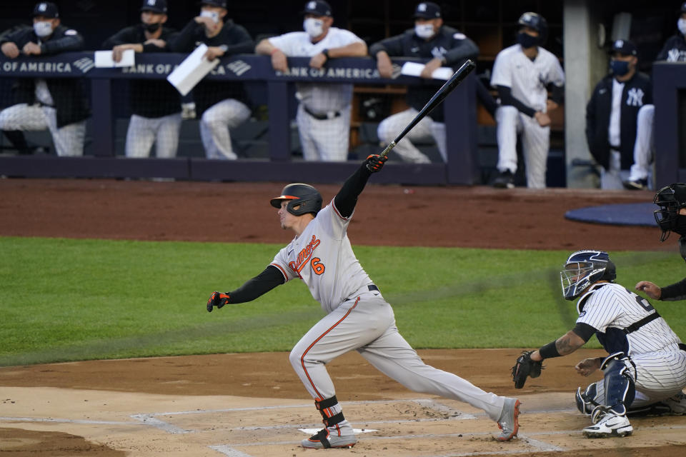 Baltimore Orioles Ryan Mountcastle (6) follows through on first-inning flyout to center field during a baseball game against the New York Yankees, Monday, April 5, 2021, at Yankee Stadium in New York. (AP Photo/Kathy Willens)