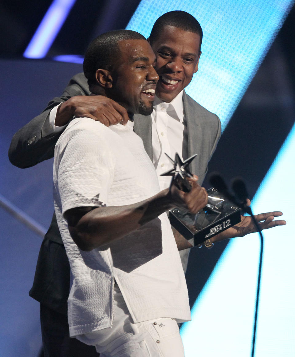 Kanye West, left, and Jay-Z accept the award for best group for "The Throne" at the BET Awards on Sunday, July 1, 2012, in Los Angeles. (Photo by Matt Sayles/Invision/AP)