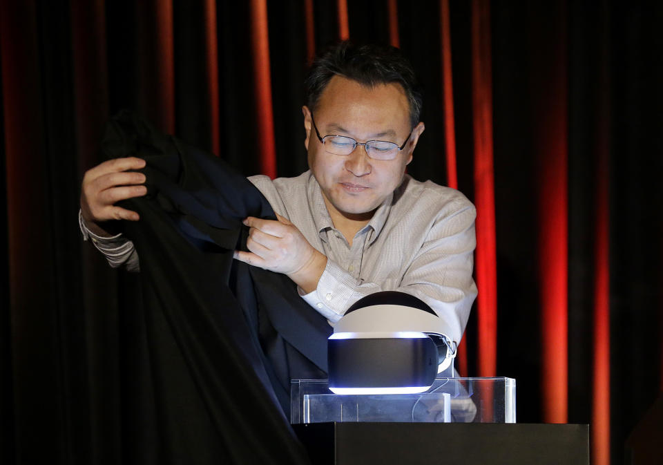 Shuhei Yoshida, president of Sony Computer Entertainment Worldwide Studios, unveils the PlayStation 4 virtual reality headset Project Morpheus at the Game Developers Conference 2014 in San Francisco, Tuesday, March 18, 2014. (AP Photo/Jeff Chiu)