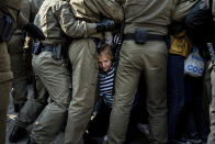 Police officers block and detain protesters during an opposition rally to protest the official presidential election results in Minsk, Belarus, Saturday, Sept. 12, 2020. Daily protests calling for the authoritarian president's resignation are now in their second month and opposition determination appears strong despite the detention of protest leaders. (AP Photo/Misha Friedman)