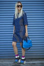 <p>A blue suede Loewe bag and funky striped Valentino booties made this denim frock that much more fun.</p>