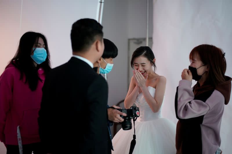 Peng Jing, 24, smiles during her wedding photography shoot after the lockdown was lifted in Wuhan