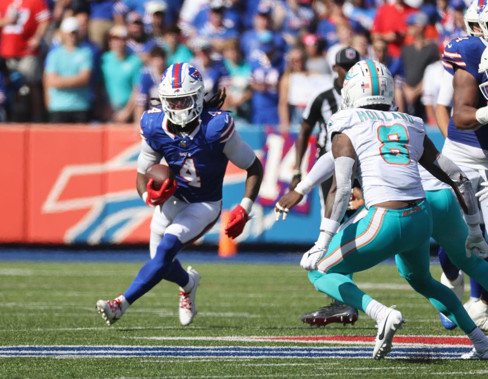 Bills running back James Cooks looks for room to run against the Dolphins.