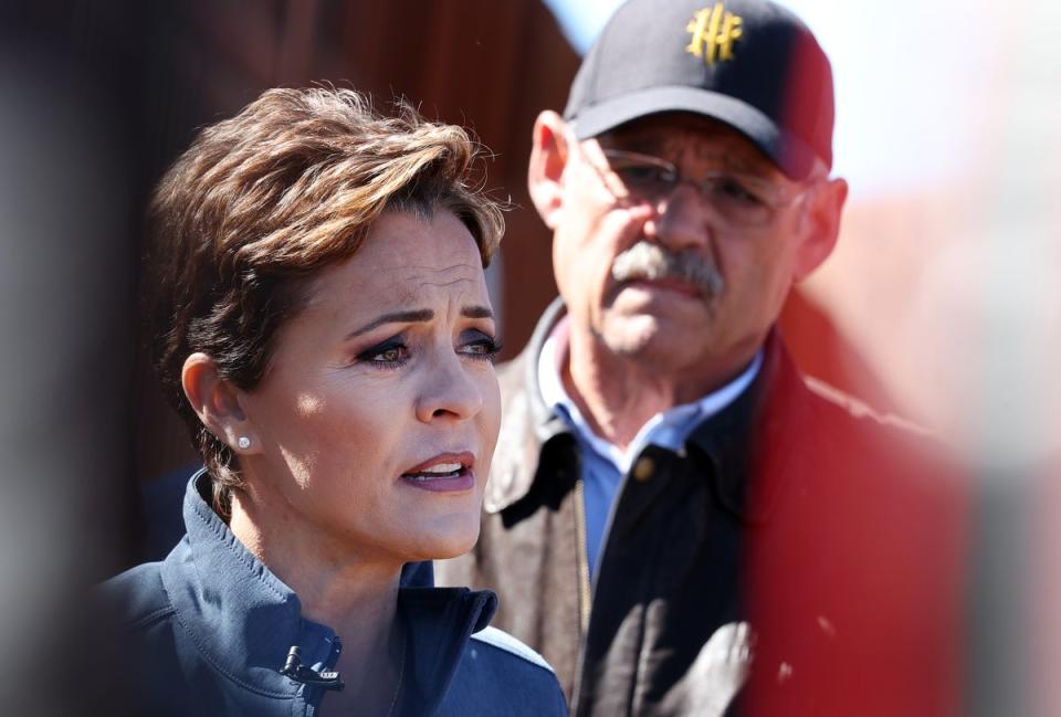 Kari Lake and Mark Finchem, GOP candidates for Arizona governor and secretary of state, respectively, are pictured on 4 November. (Getty Images)