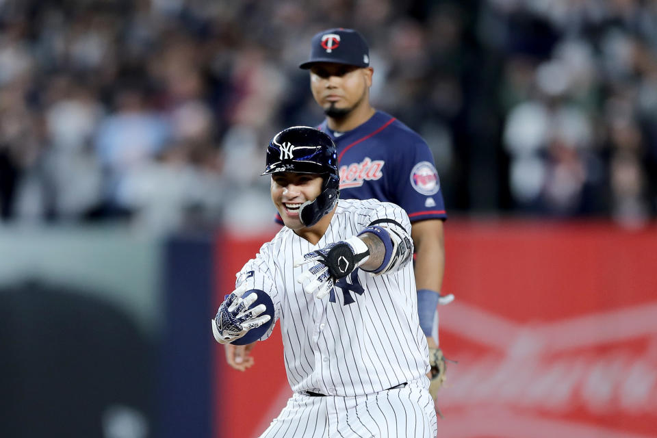 Gleyber Torres #25 of the New York Yankees celebrates after hitting an RBI double to score Aaron Judge #99 and Brett Gardner #11 against Tyler Duffey #21 of the Minnesota Twins during the fifth inning in game one of the American League Division Series at Yankee Stadium on October 04, 2019 in New York City. (Photo by Elsa/Getty Images)