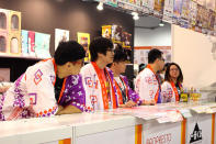 Staff decked out in Japanese garb at the Ichiban Kuji booth that sells anime merchandise. (Photo: Sharlene Sankaran/Yahoo Singapore)