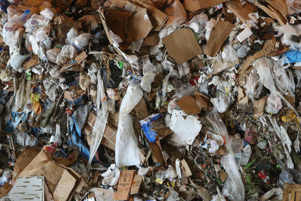 Piles of trash wait to be taken to a landfill at the Republic Recycling processing facility in Indianapolis on Wednesday, Sept. 9, 2020.