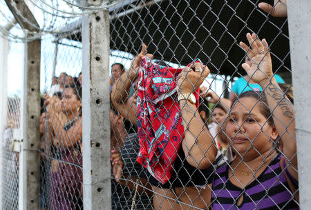 Relatives of inmates react in front of a prison complex in the Brazilian state of Amazonas after prisoners were found strangled to death in four separate jails, according to the penitentiary department in Manaus, Brazil May 27, 2019. REUTERS/Bruno Kelly