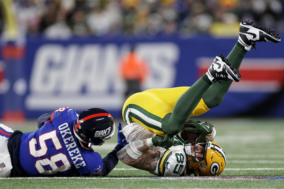 Green Bay Packers tight end Tucker Kraft (85) is tackled by New York Giants linebacker Bobby Okereke (58) during the second quarter of an NFL football game, Monday, Dec. 11, 2023, in East Rutherford, N.J. (AP Photo/Adam Hunger)