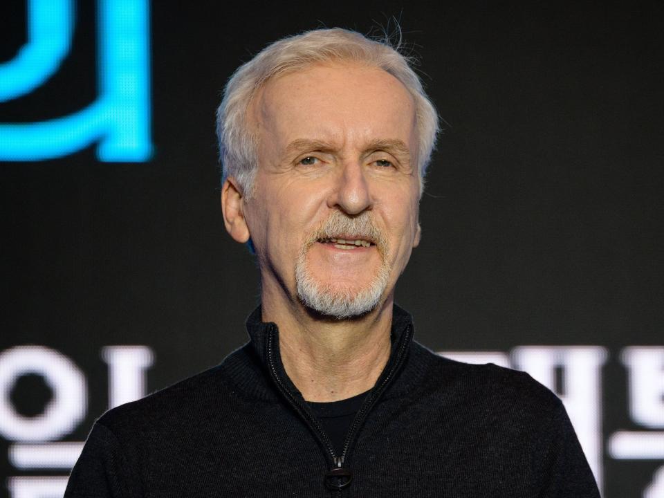 James Cameron wearing a black shirt and smiling