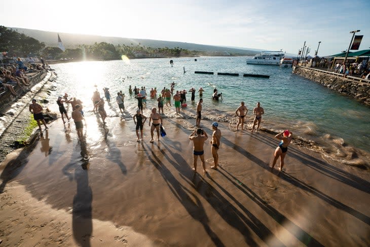 Athletes go for a training swim at the Kona Pier. Kona locals are mad about the Ironman World Championship taking over the town for two days.