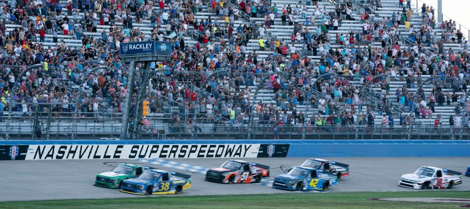 The Rackley Roofing 200 NASCAR Truck Series Race races past the green flag as the race gets started at the  Nashville Superspeedway Friday, June 24, 2022, in Lebanon, Tenn. 