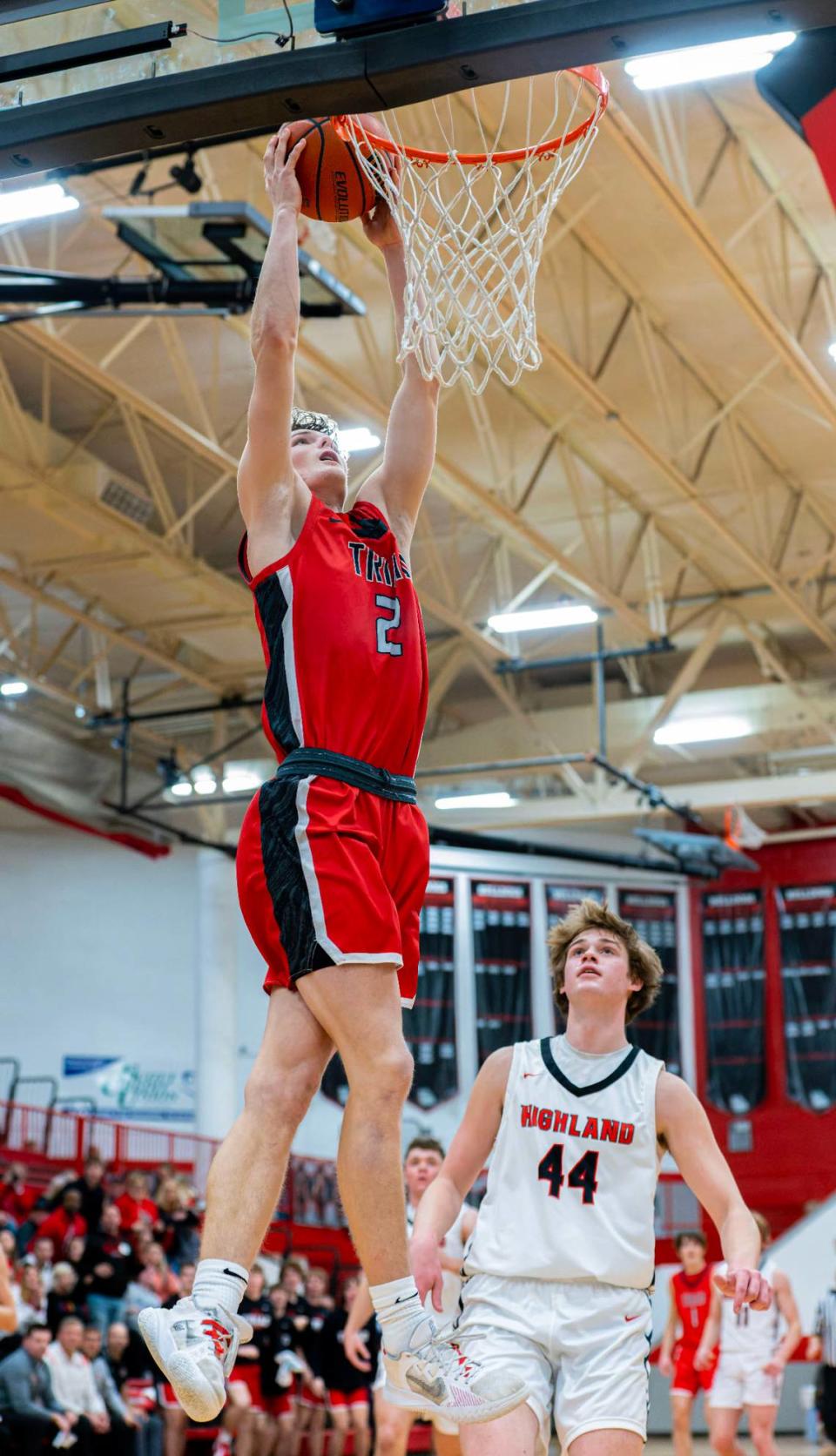 Triad’s Jake Stewart goes up for the dunk during Friday night’s Mississippi Valley Conference game against Highland. The Knights ultimately posted a 50-37 victory.