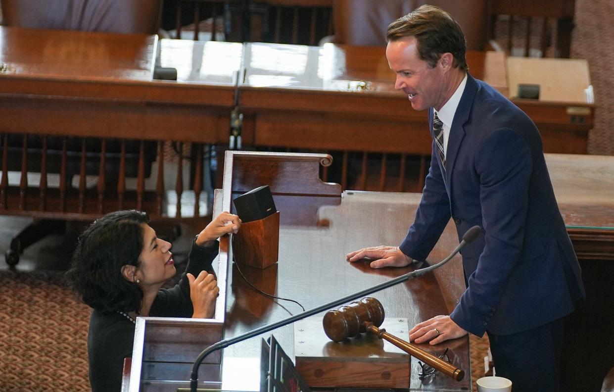 Texas Senator Carol Alvarado, left speaks with Speaker of the House Dade Phelan, R-Beaumont, during the third day of the 88th Texas Legislative Session in Austin, Texas, Thursday, Jan. 12, 2023.