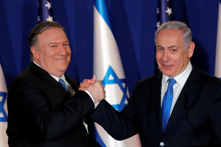 U.S. Secretary of State Mike Pompeo shake hands with Israeli Prime Minister Benjamin Netanyahu, during their visit at Netanyahu's official residence in Jerusalem March 21, 2019. REUTERS/Jim Young/Pool