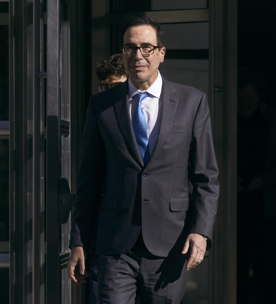 Former United States Secretary of the Treasury, Steven Mnuchin, center, leaves the Brooklyn Federal Court on Thursday, Oct. 20, 2022, in the Brooklyn borough of New York. (AP Photo/Andres Kudacki)