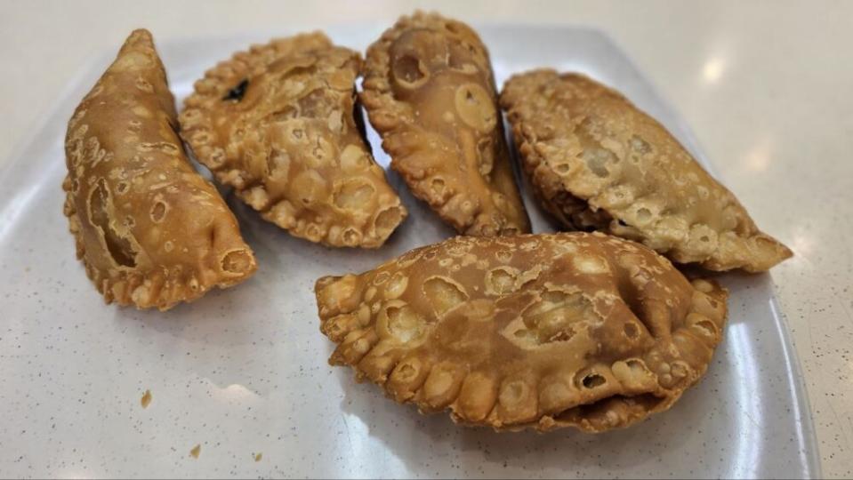 indian rojak - curry puff on a plate