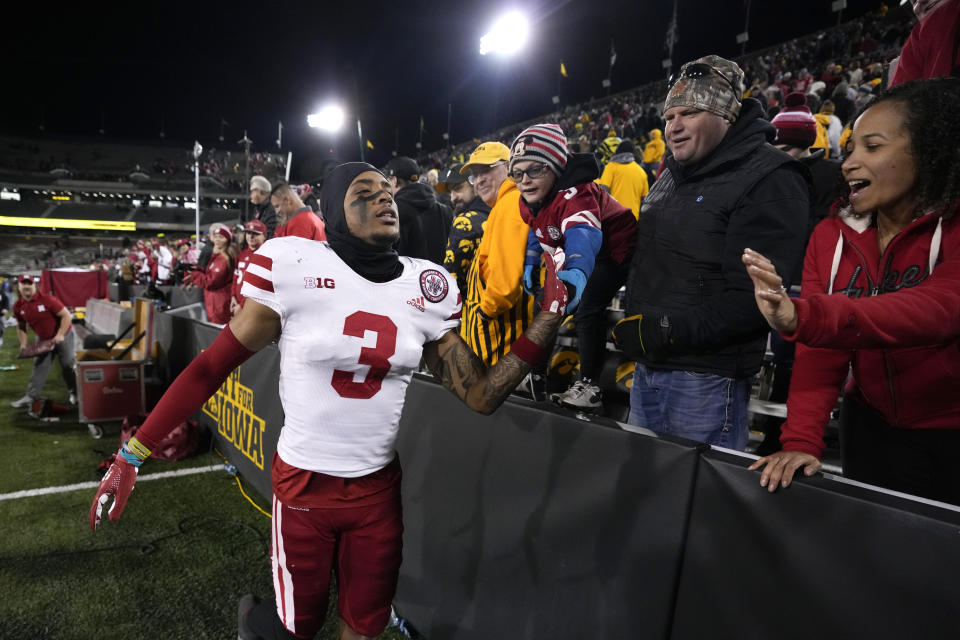 Nebraska wide receiver Trey Palmer (3) celebrates with fans after an NCAA college football game against Iowa, Friday, Nov. 25, 2022, in Iowa City, Iowa. Nebraska won 24-17. (AP Photo/Charlie Neibergall)