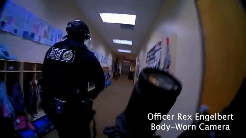 A still image from body-worn camera footage of Metro Nashville Police officers entering The Covenant School during a mass shooting where three children and three adults were killed Monday, March 27, 2023, in Nashville, Tenn. The shooter was killed by police on the scene.