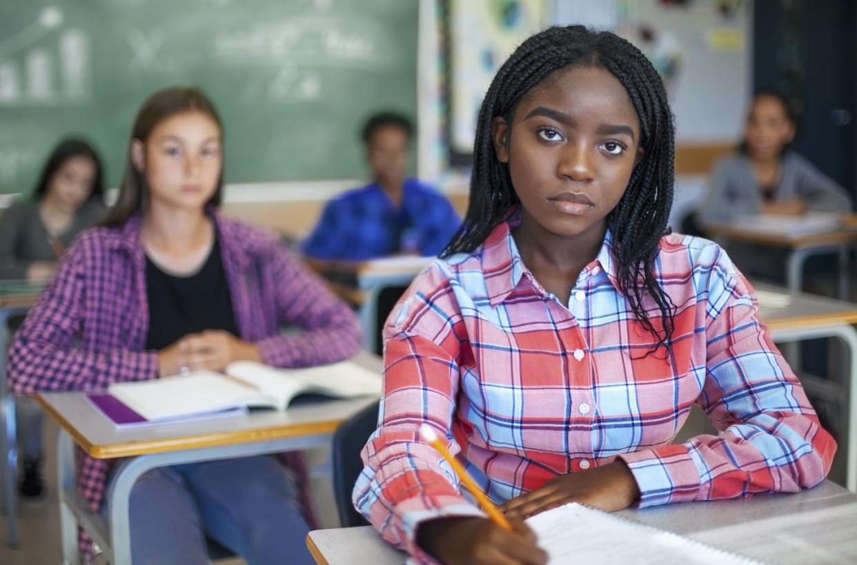 A growing number of states have passed laws that restrict what teachers can teach about racism. <a href="https://www.gettyimages.com/detail/photo/portrait-of-concerned-black-ethnicity-student-royalty-free-image/1279902711?phrase=social+studies+class&adppopup=true" rel="nofollow noopener" target="_blank" data-ylk="slk:FangXiaNuo via Getty Images;elm:context_link;itc:0;sec:content-canvas" class="link ">FangXiaNuo via Getty Images</a>