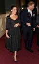 in a custom Erdem black brocade dress with Jessica McCormack hoop earrings, black Aquazzura bow-adorned pumps, and the traditional red poppy pin at the annual Royal British Legion Festival of Remembrance in London.