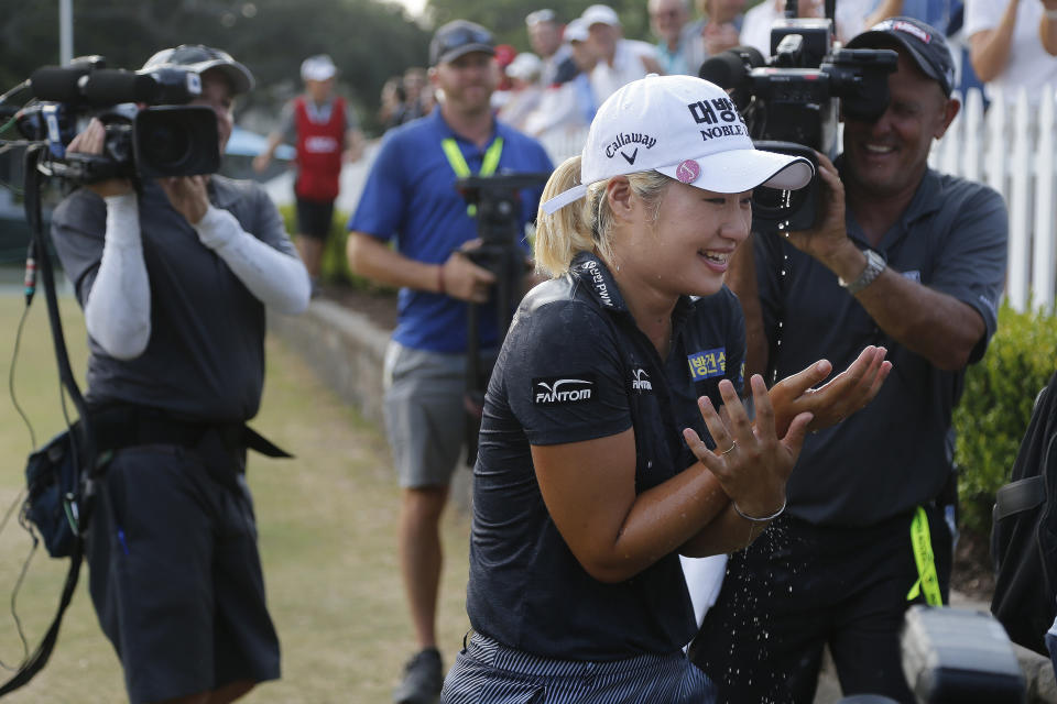 Jeongeun Lee6 of South Korea, reacts to being doused with Champagne after winning the final round of the U.S. Women's Open golf tournament, Sunday, June 2, 2019, in Charleston, S.C. (AP Photo/Steve Helber)