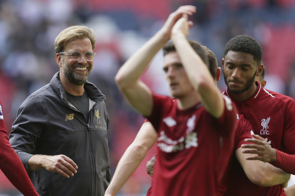 Liverpool's coach Jurgen Klopp center, celebrates with Liverpool's players after winning the English Premier League soccer match between Tottenham Hotspur and Liverpool at Wembley Stadium in London, Saturday Sept. 15, 2018. (AP Photo/Tim Ireland)