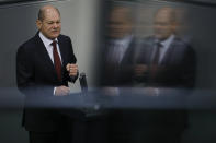 File - In this Tuesday, Dec. 8, 2020 file photo, German Finance Minister Olaf Scholz delivers his speech during the debate about Germany's budget 2021, at the parliament Bundestag in Berlin, Germany. Germany's election campaign has largely focused on the three candidates hoping to succeed Angela Merkel as chancellor after four terms in office, Annalena Baerbock for the Greens, Armin Laschet for the Christian Union parties and Olaf Scholz for the Social Democrats. German elections will be on Sept.26.(AP Photo/Markus Schreiber, File)