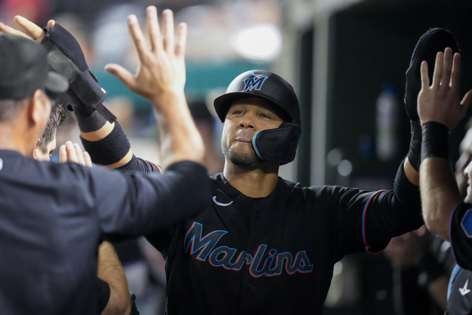 Miami Marlins' Yuli Gurriel celebrates after scoring the go-ahead run against the Washington Nationals during the eighth inning of a baseball game at Nationals Park, Friday, June 16, 2023, in Washington. The Marlins won 6-5. (AP Photo/Alex Brandon)