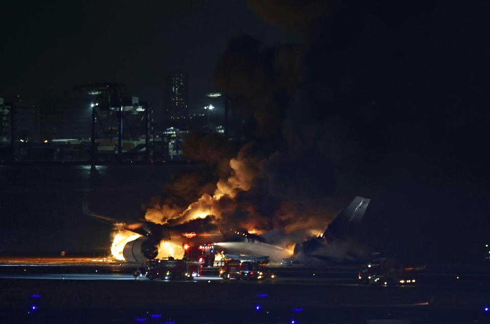 A Japan Airlines plane is on fire on the runway of Haneda airport on Tuesday, 2 January 2024 in Tokyo, Japan (AP)