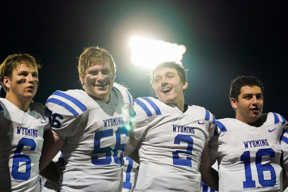 From left, Wyoming’s Coleman Jeffers, Jess Hauer, Quaid Hauer and Jack Randman sing the alma mater following their 49-0 victory against the Taylor Yellowjackets during a high school football game at Don McMillian Stadium on Friday, Sept. 30, 2022. Wyoming is 8-0 and leads Division IV, Region 16.