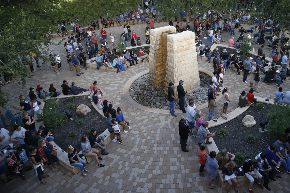 People attend a memorial service for the victims of a shooting spree the day before, Sunday, Sept. 1, 2019, in Odessa, Texas. (AP Photo/Sue Ogrocki)