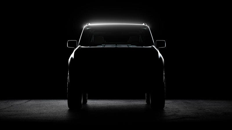 Teaser image of the front end of a Scout EV in darkness