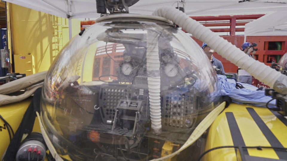 A submersible after British scientist and her American pilot had to make an emergency ascent from 250 meters beneath the surface of the Indian ocean off the Seychelles after smoke filled their two-person submersible, Tuesday March 19, 2019. The pair, from the UK-led Nekton Mission investigating climate change in the region, are both safe onboard the mother ship where an electrical fire aboard the sub is being investigated as the possible cause. (AP Photo/David Keyton)