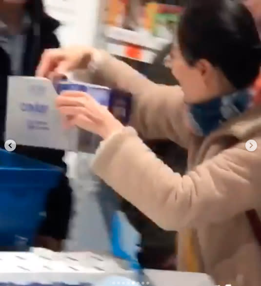 Screenshot of woman grabbing a whole box of Aldi's Caviar Cream Special Buy