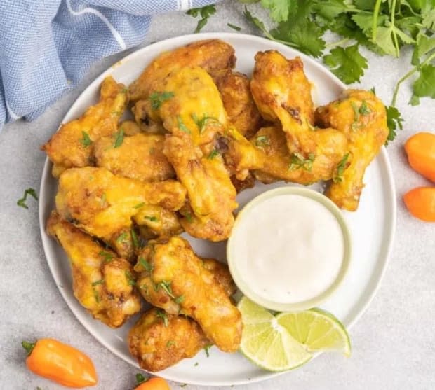 <p><a href="https://thebustedoven.com/air-fryer-mango-habanero-hot-wings/" rel="nofollow noopener" target="_blank" data-ylk="slk:The Busted Oven;elm:context_link;itc:0;sec:content-canvas" class="link ">The Busted Oven</a></p>