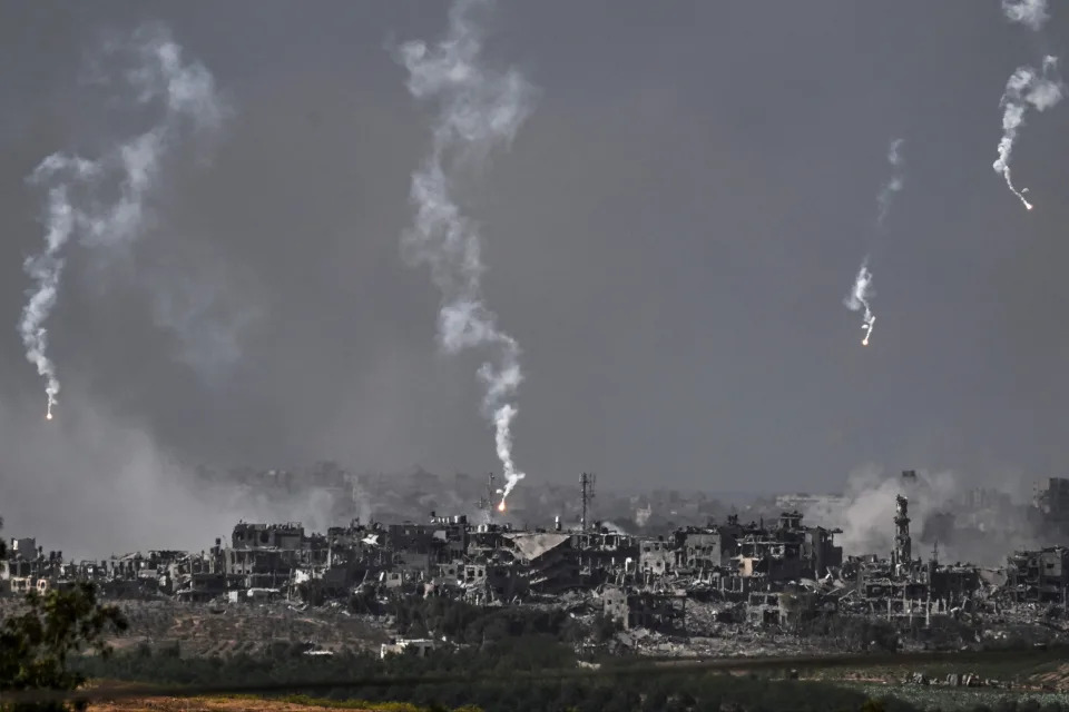 A picture taken from Israel's southern city of Sderot shows flares dropped by Israeli forces above the north of the Gaza Strip (AFP via Getty Images)