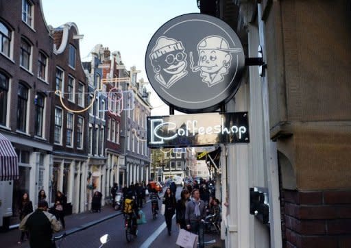 The neon sign of a coffee shop in Amsterdam in 2011. Amsterdam's famous cannabis cafes will remain open for business with foreign thrill-seekers despite the new government's plan to restrict sales to locals only, the Dutch capital's mayor said