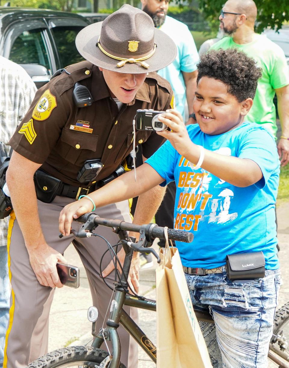 Community members gather in Knollwood for a peace walk on Thursday, June 29, 2023.