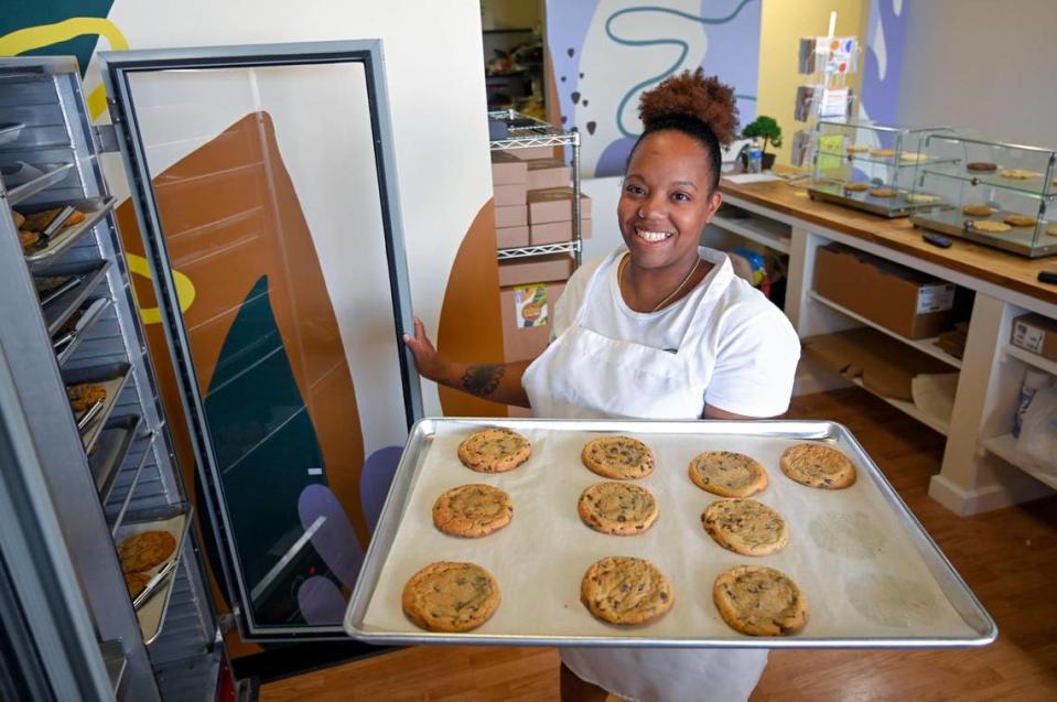 Asia Lockett, one of three owners of Brown Suga, was busy filling orders for cookies on Friday, June 9, 2023, at the cookie shop which opened in May at 1066 W. Santa Fe St., Olathe.